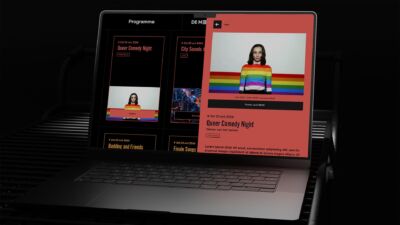 Laptop met de website van Poppodium De Meester